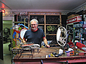 John Hayward in his Austin neon shop. 